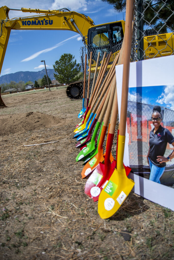 Close up photograph of brightly colored shovels