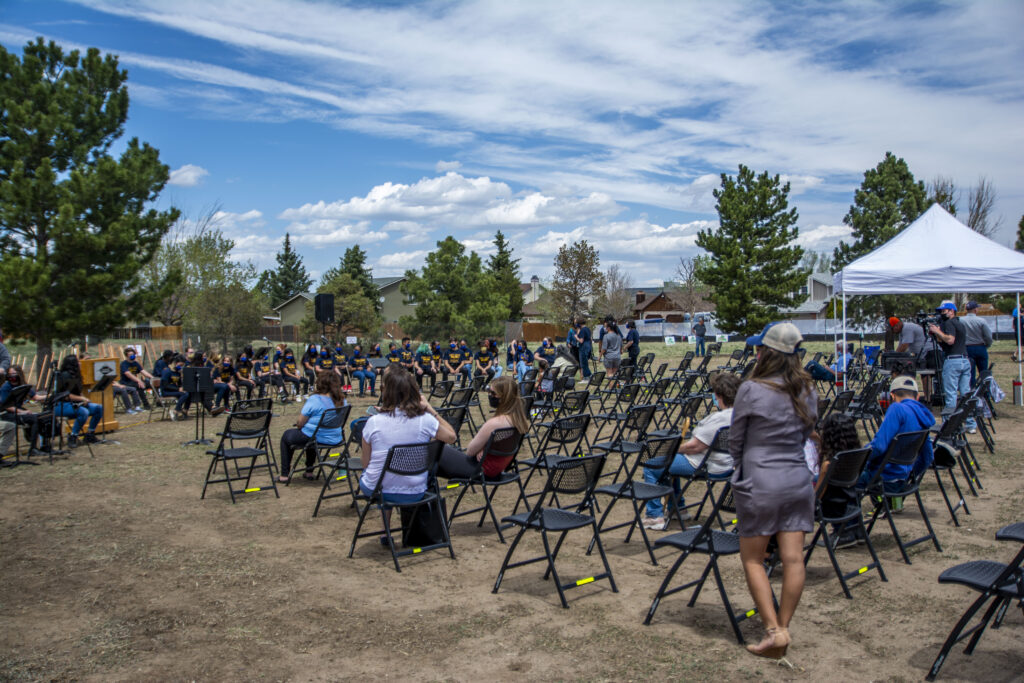 Photo of lots of chairs and people sitting at Panorama Park during the building phase